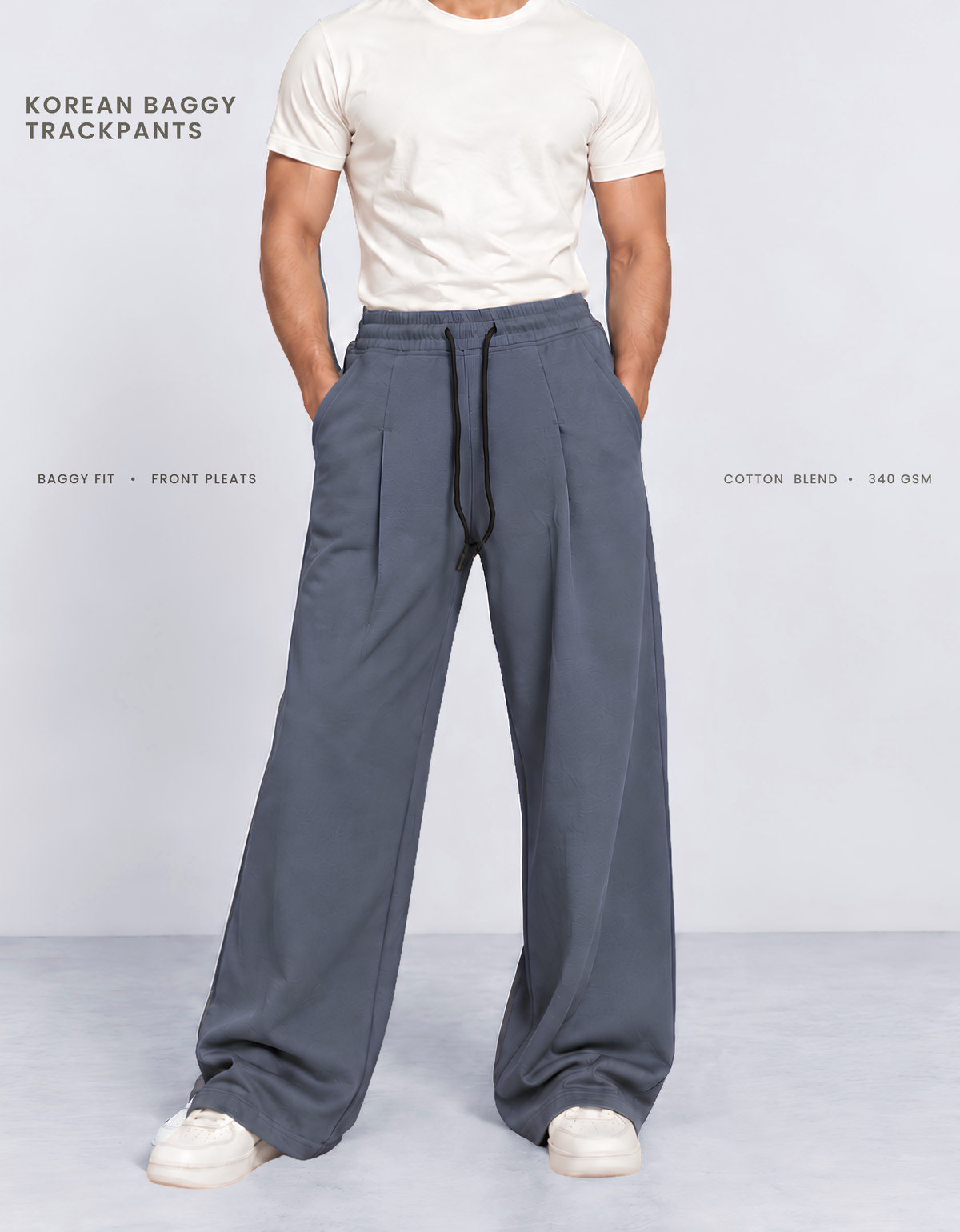 Model wearing blue Korean baggy pants, front view showing wide-leg silhouette and front pleats