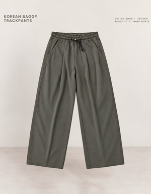 Olive green Korean baggy pants front view, 340 GSM cotton blend with elasticated waistband and drawcord