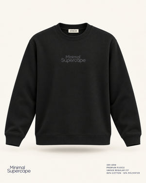 Minimal Black Unisex Sweatshirt — premium 3D front view with original tonal chest wordmark and SuperCape neck label