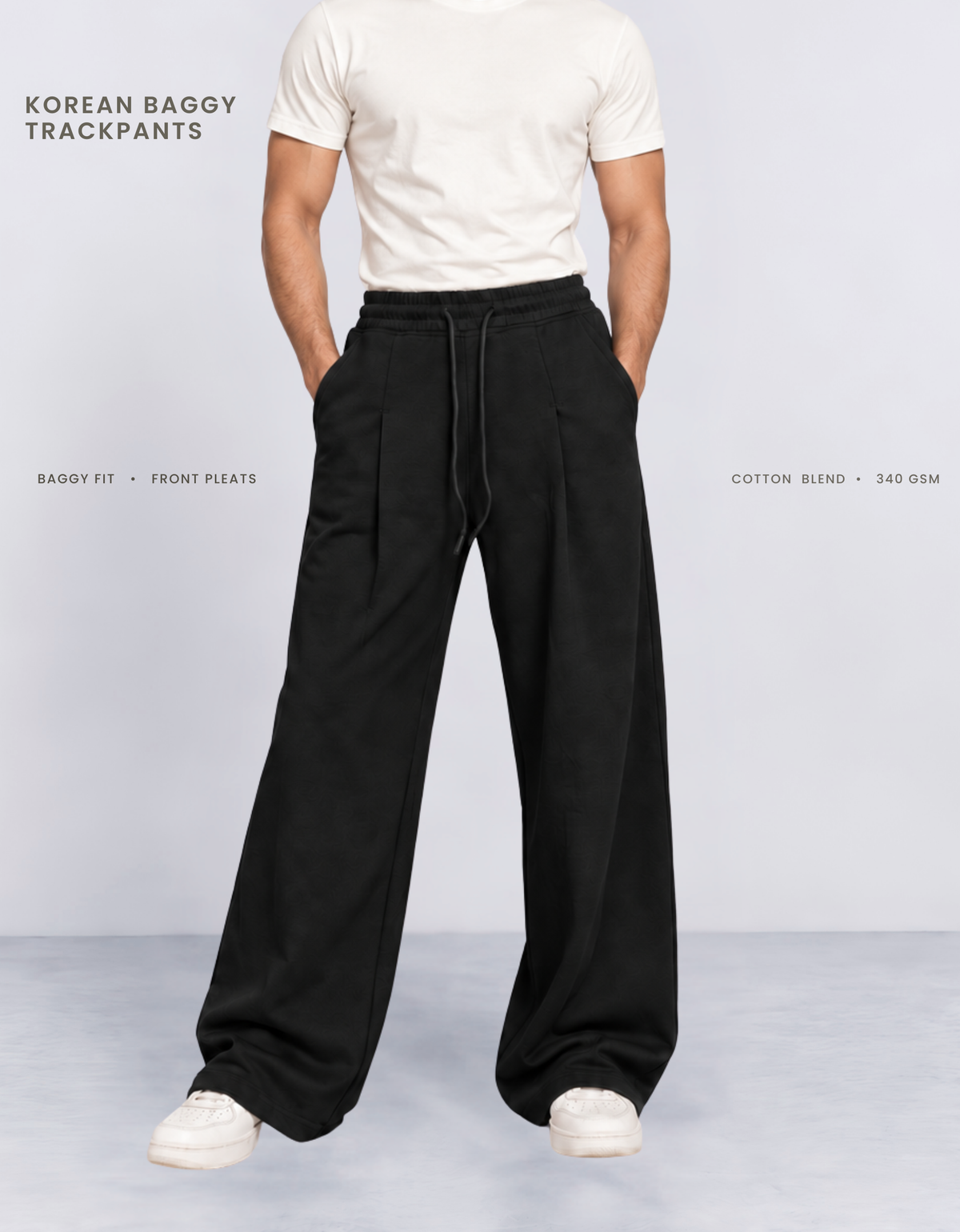 Model wearing black Korean baggy pants, front view showing wide-leg silhouette and front pleats