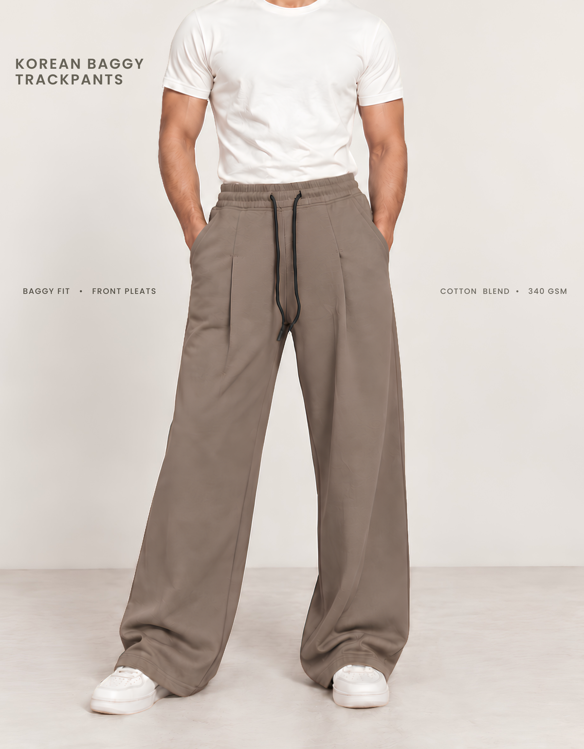 Model wearing brown Korean baggy pants, front view showing wide-leg silhouette and front pleats