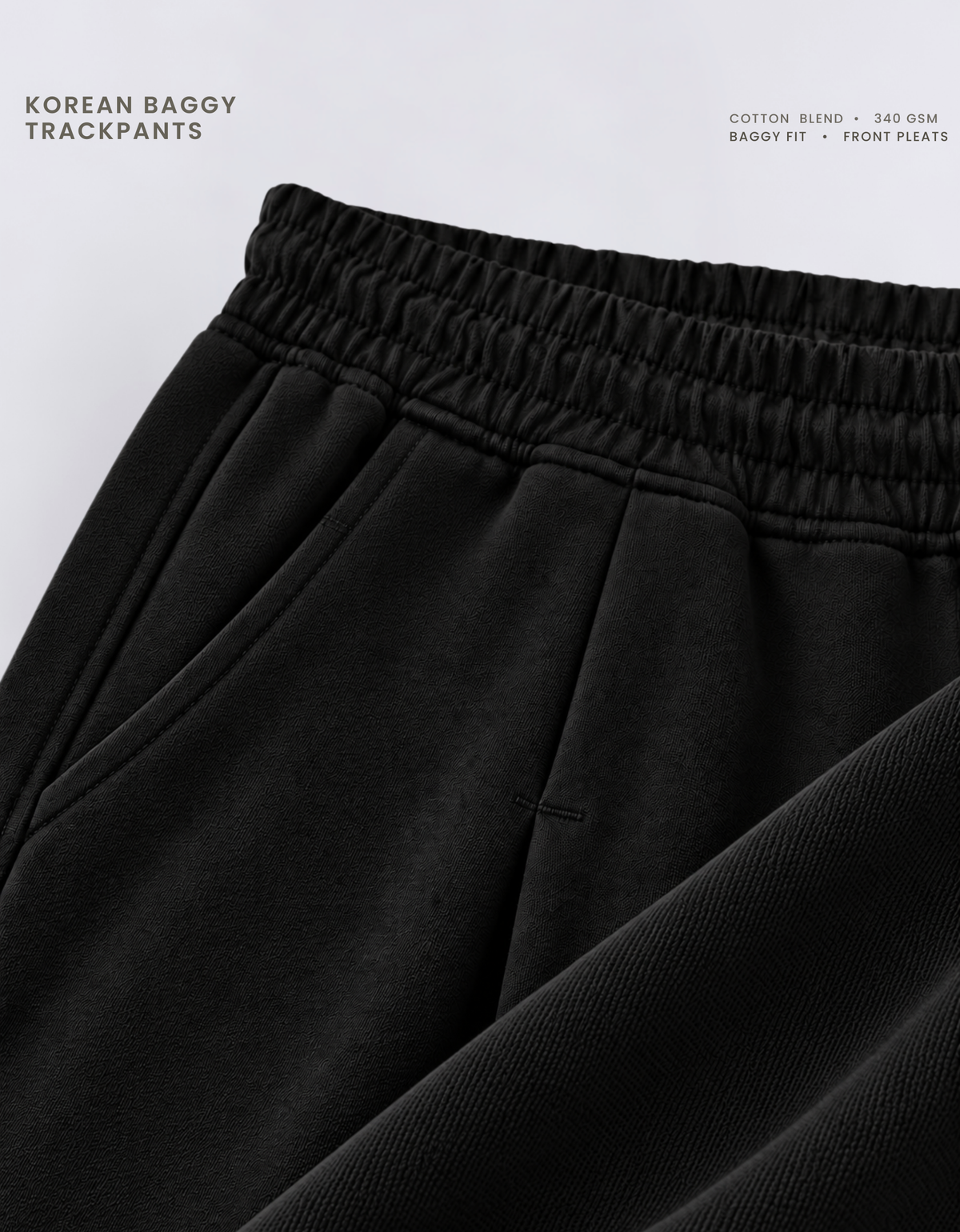 Front pleat stitching and side pocket detail on black Korean baggy pants, 340 GSM cotton blend