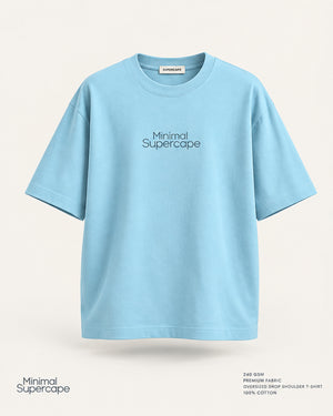 Minimal Baby Blue Oversized T-Shirt – premium front view with Minimal Supercape chest typography and SuperCape neck label; 240 GSM premium fabric, oversized drop shoulder T-shirt, 100% cotton