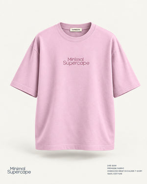 Minimal Baby Pink Oversized T-Shirt – premium front view with Minimal Supercape chest typography and SuperCape neck label; 240 GSM premium fabric, oversized drop shoulder T-shirt, 100% cotton