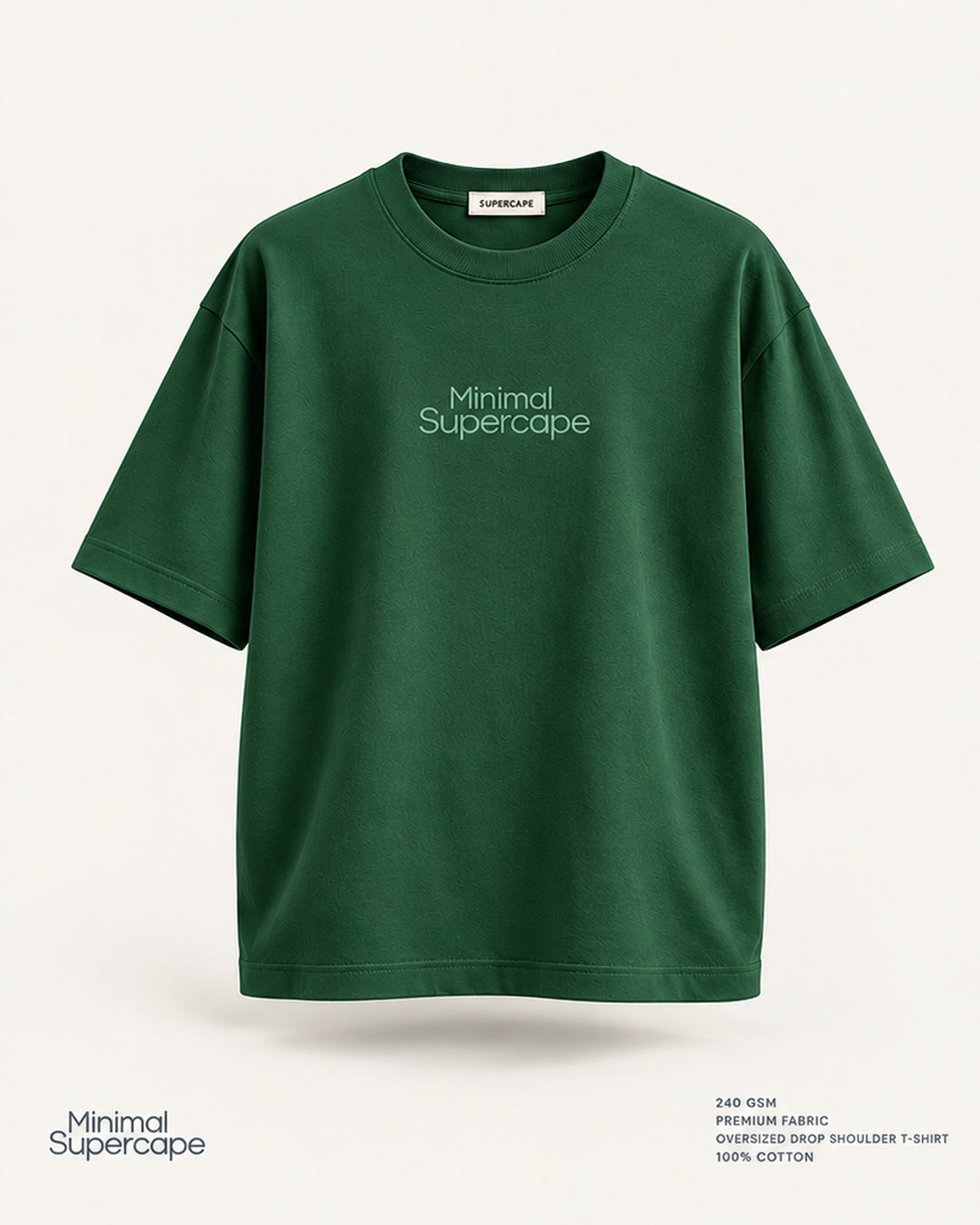 Minimal Bottle Green Oversized T-Shirt – premium front view with Minimal Supercape chest typography and SuperCape neck label; 240 GSM premium fabric, oversized drop shoulder T-shirt, 100% cotton
