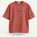 Minimal Coral Oversized T-Shirt – premium front view with Minimal Supercape chest typography and SuperCape neck label; 240 GSM premium fabric, oversized drop shoulder T-shirt, 100% cotton