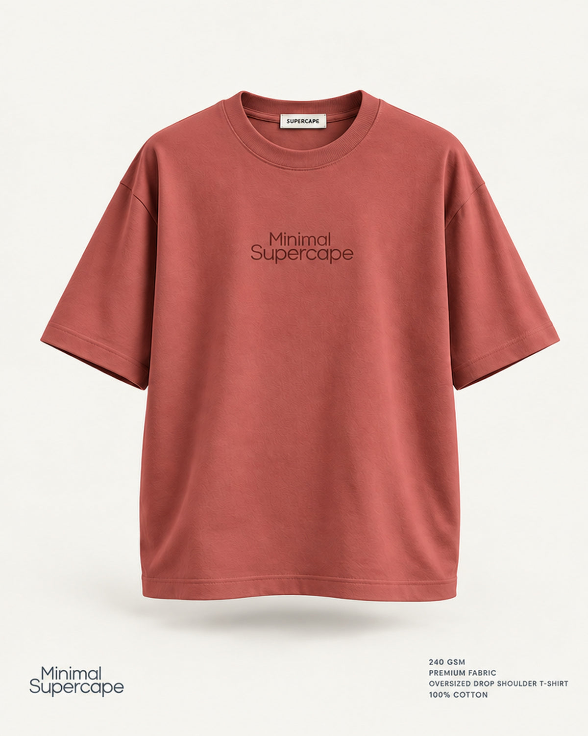 Minimal Coral Oversized T-Shirt – premium front view with Minimal Supercape chest typography and SuperCape neck label; 240 GSM premium fabric, oversized drop shoulder T-shirt, 100% cotton
