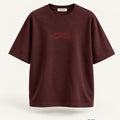 Minimal Maroon Oversized T-Shirt – premium front view with Minimal Supercape chest typography and SuperCape neck label; 240 GSM premium fabric, oversized drop shoulder T-shirt, 100% cotton