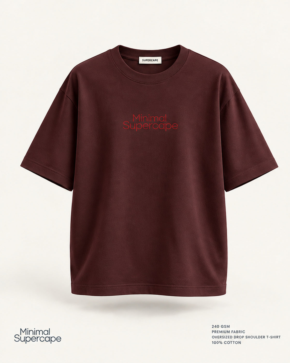 Minimal Maroon Oversized T-Shirt – premium front view with Minimal Supercape chest typography and SuperCape neck label; 240 GSM premium fabric, oversized drop shoulder T-shirt, 100% cotton