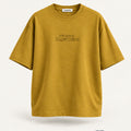 Minimal Mustard Oversized T-Shirt – premium front view with Minimal Supercape chest typography and SuperCape neck label; 240 GSM premium fabric, oversized drop shoulder T-shirt, 100% cotton
