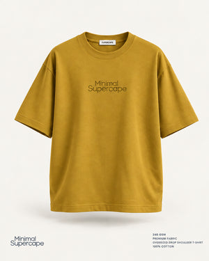 Minimal Mustard Oversized T-Shirt – premium front view with Minimal Supercape chest typography and SuperCape neck label; 240 GSM premium fabric, oversized drop shoulder T-shirt, 100% cotton
