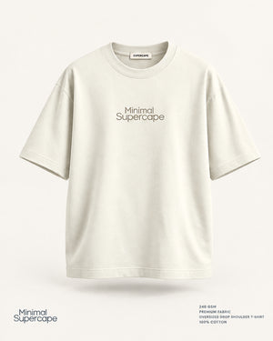 Minimal Off-White Oversized T-Shirt – premium front view with Minimal Supercape chest typography and SuperCape neck label; 240 GSM premium fabric, oversized drop shoulder T-shirt, 100% cotton