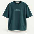 Minimal Petrol Blue Oversized T-Shirt – premium front view with Minimal Supercape chest typography and SuperCape neck label; 240 GSM premium fabric, oversized drop shoulder T-shirt, 100% cotton